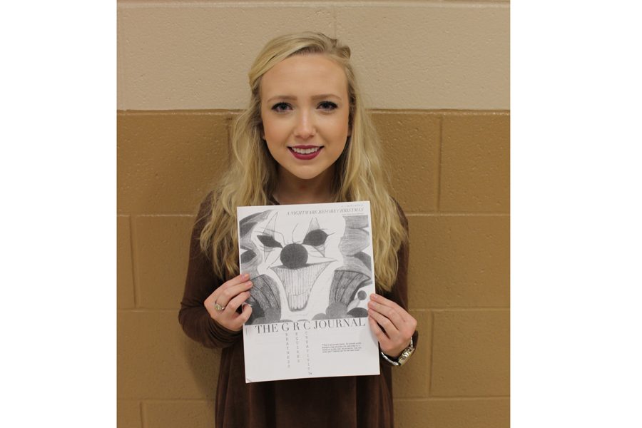 Co-founder Katie Wheeler holds the Literary Journals first issue. 