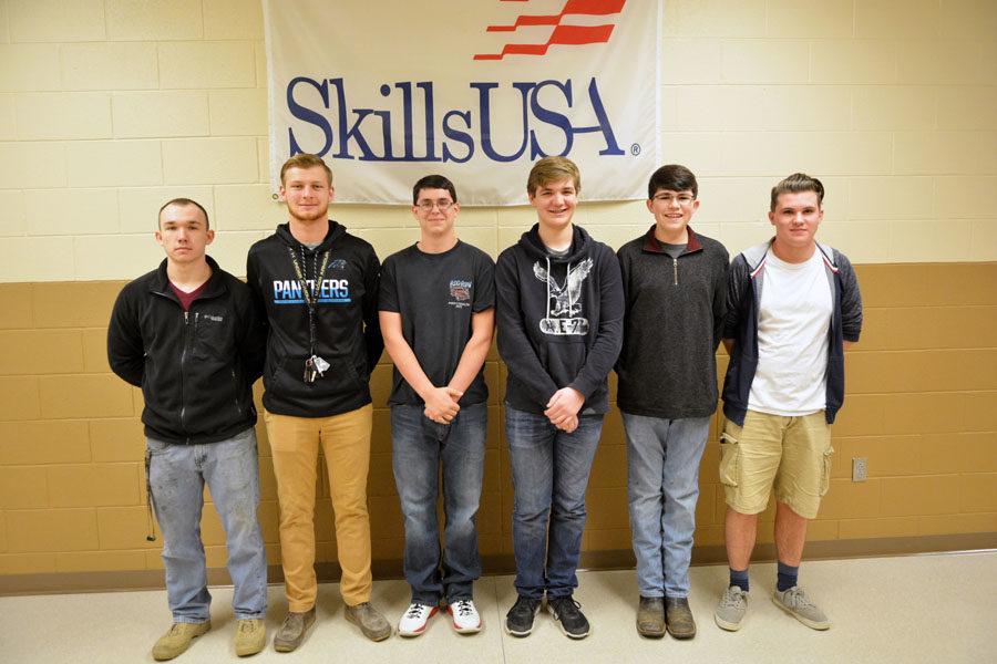 State qualifiers in Skills USA pose in front of banner. Not pictured: Austin Cartwright.