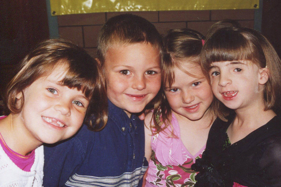 Erika Barker, right, poses with friends during her childhood.