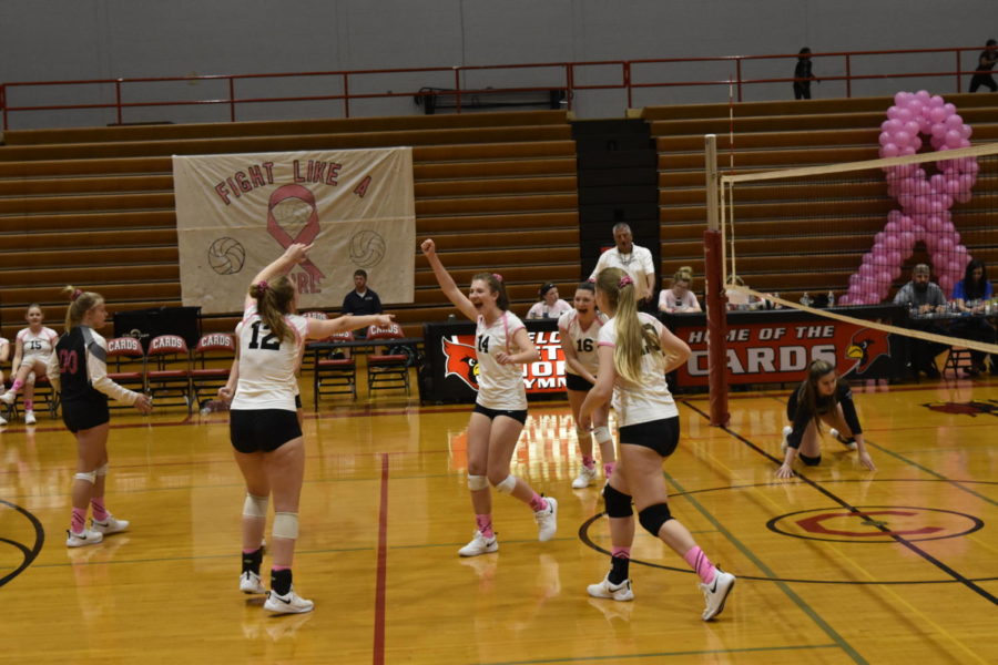 Teammates celebrate a hard-earned point.