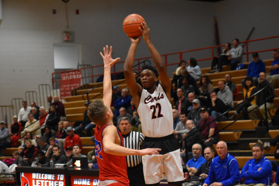 Jordan Graham goes up for a shot in the first half. Graham gave GRC an early edge against Madison Central, hitting 3 three-pointers in the first quarter.