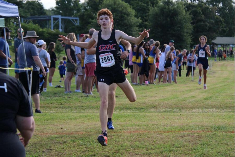 Hayden Cecil jumps to the finish line at a Lykins Park meet.
