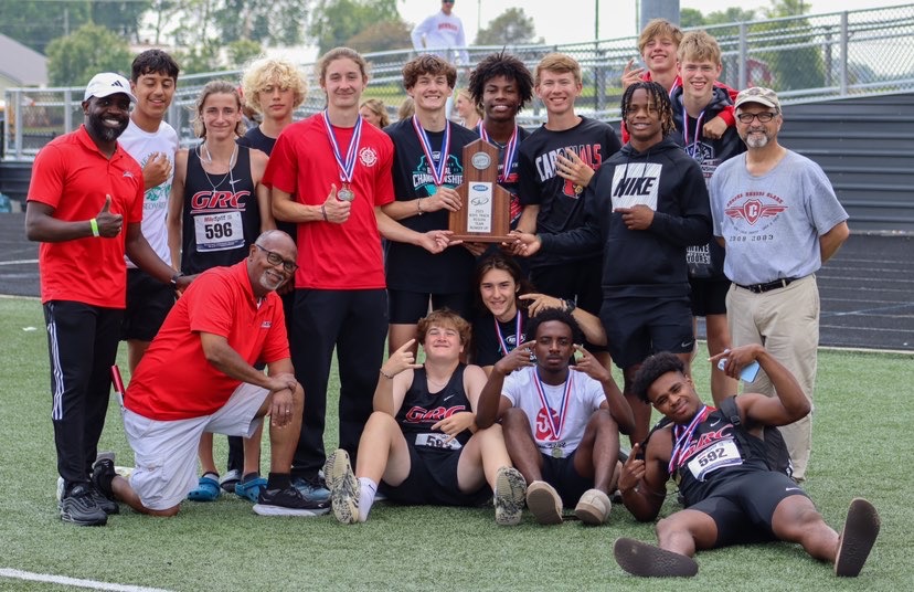 Boys track team celebrates the schools first-ever region track trophy after placing second in one of the states toughest regions.