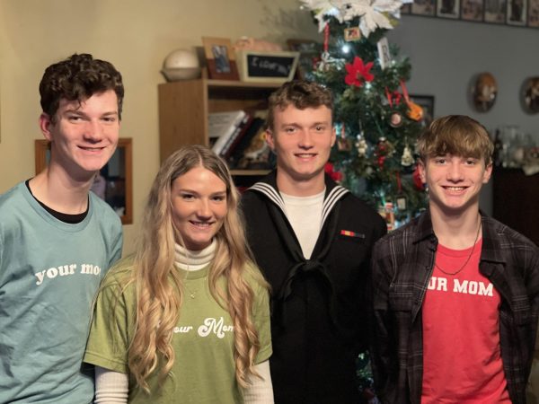 The Ross Siblings – Zach, Carlyn, Zeke, Levi – celebrate Zeke’s Christmas arrival in 2021.