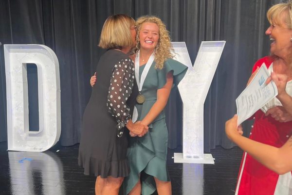 GRC senior Maddie Goeing is congratulated by Clark County DYW committee chair Donna Fuller after winning the local program in August.