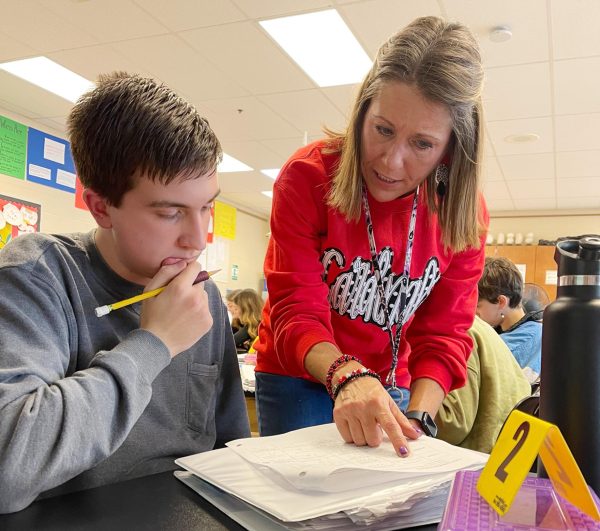 Stephanie Jefferson helps a student in her freshman Pre AP Biology class.