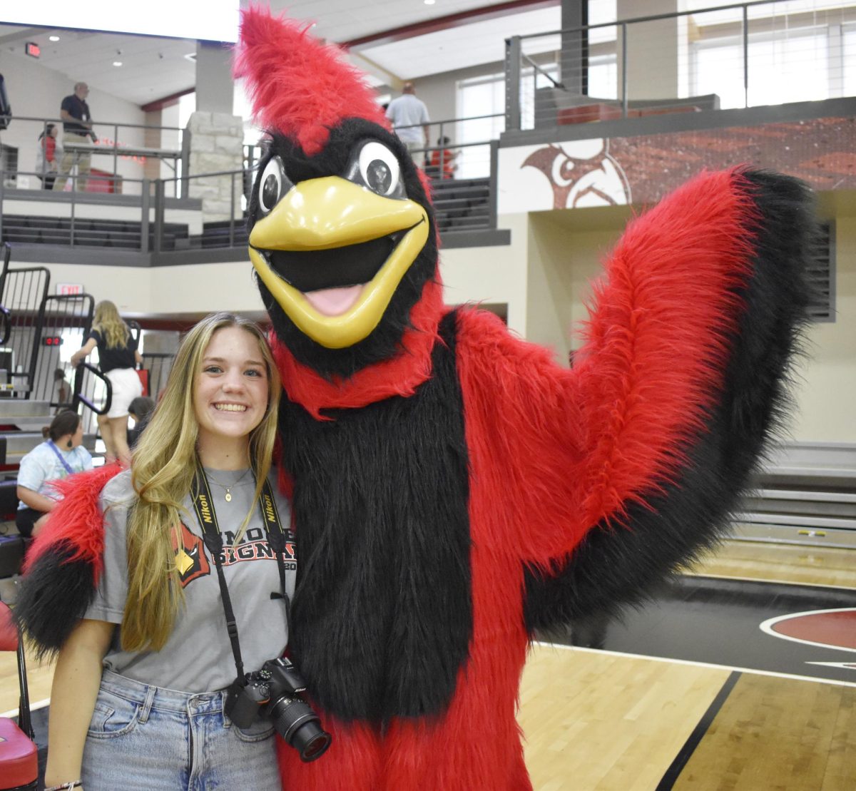 Caroline Harper with the Cardinal at the Opening Day celebration