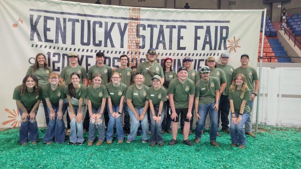 FFA students who participated in the dairy, livestock, and meat contests at the Kentucky State Fair pose outside the arena.