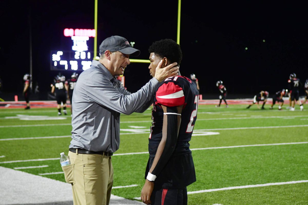 Coach Joe Chirico encourages junior TaJada Hooten.