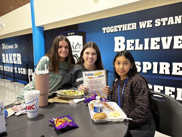 GRC seniors Anna Barnes and Gracie Cecil with Baker student Zuleymi Perez Flores