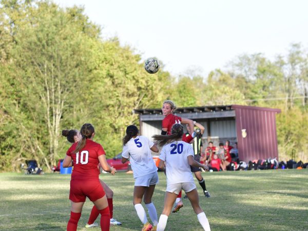 Reese Patrick nails a header during the district championship.