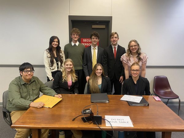 Mock Trial Region Champs sitting, David Muse, Katelyn Fulks, Caroline Harper, Mallory Jones; back, Genesis Smith, Josh Muse, Carter Johnston, Jones Howard, Ella Howton